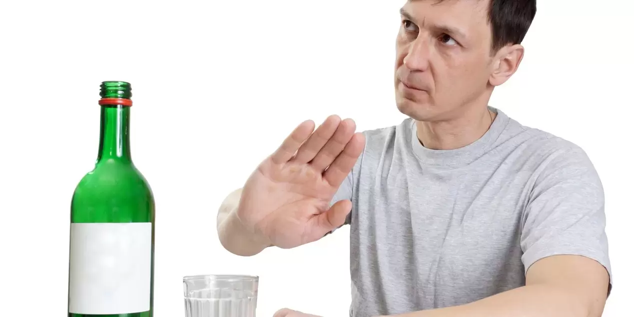 A man rejects alcohol